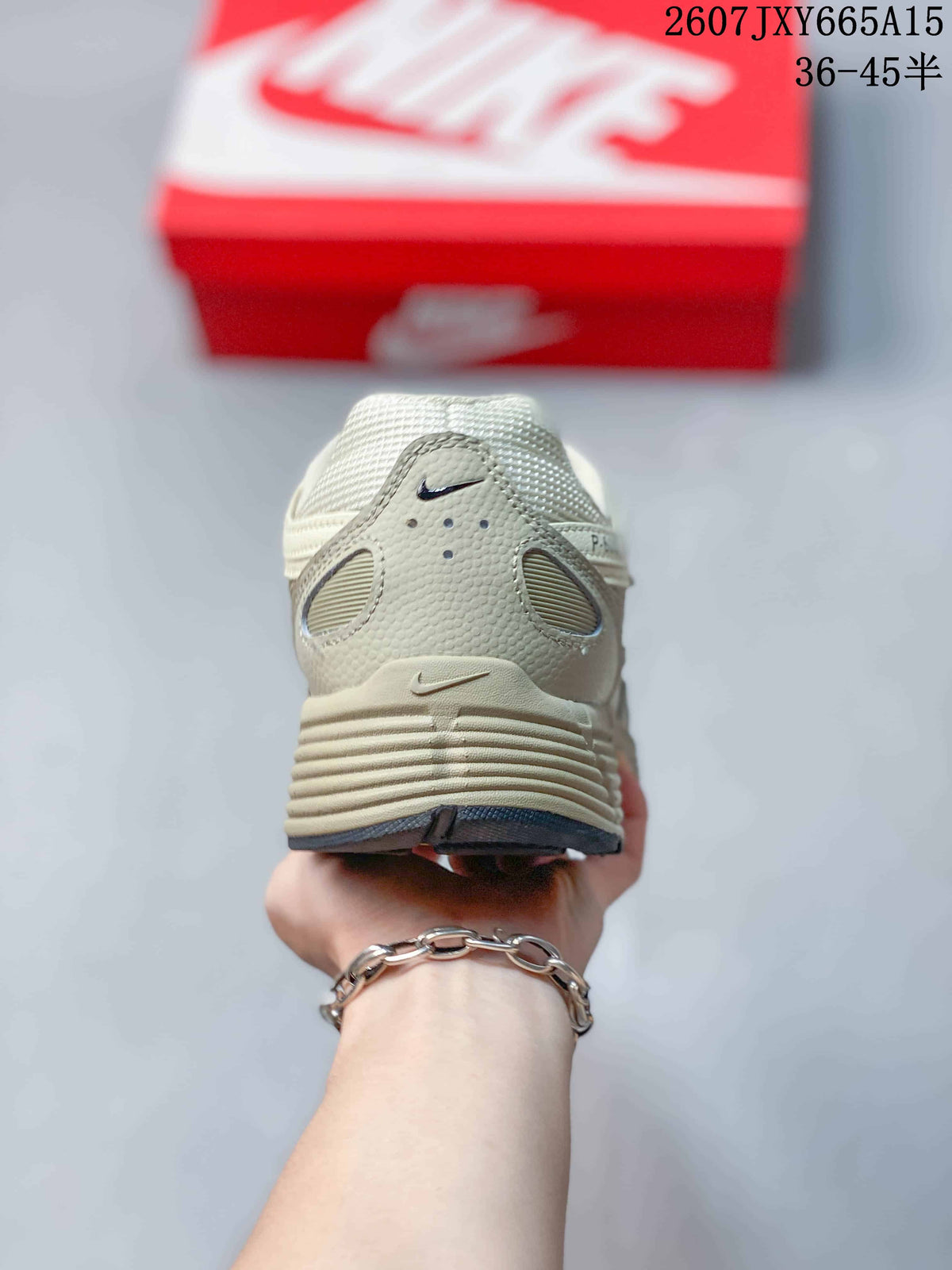 Rear view showing the padded heel collar, heel overlays, and layered outsole design.