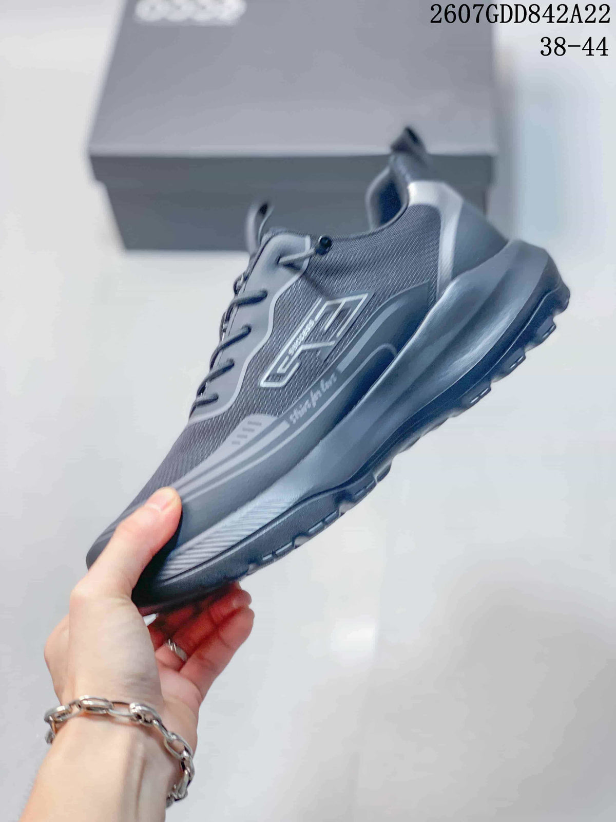 Side profile of the dark gray ECCO sneaker highlighting the mesh-textured upper, layered panels, and rugged sole.