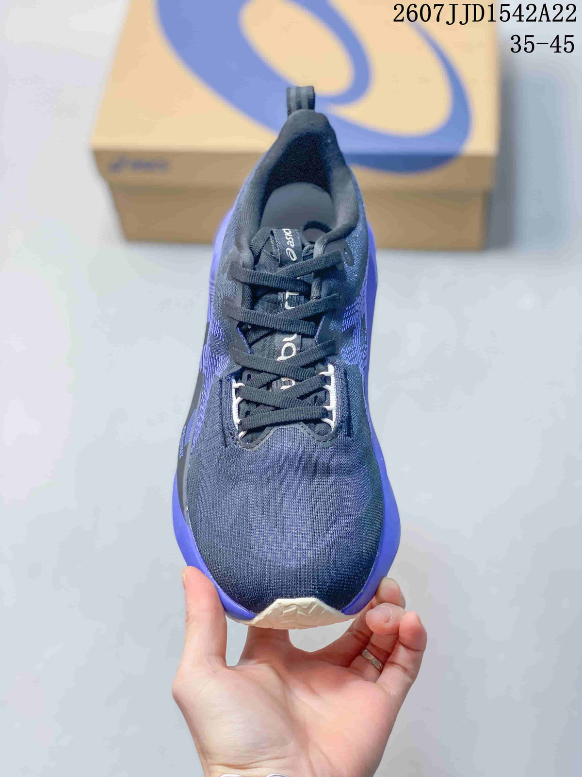 Top view showing the rounded toe, dark laces, tongue and textile upper.