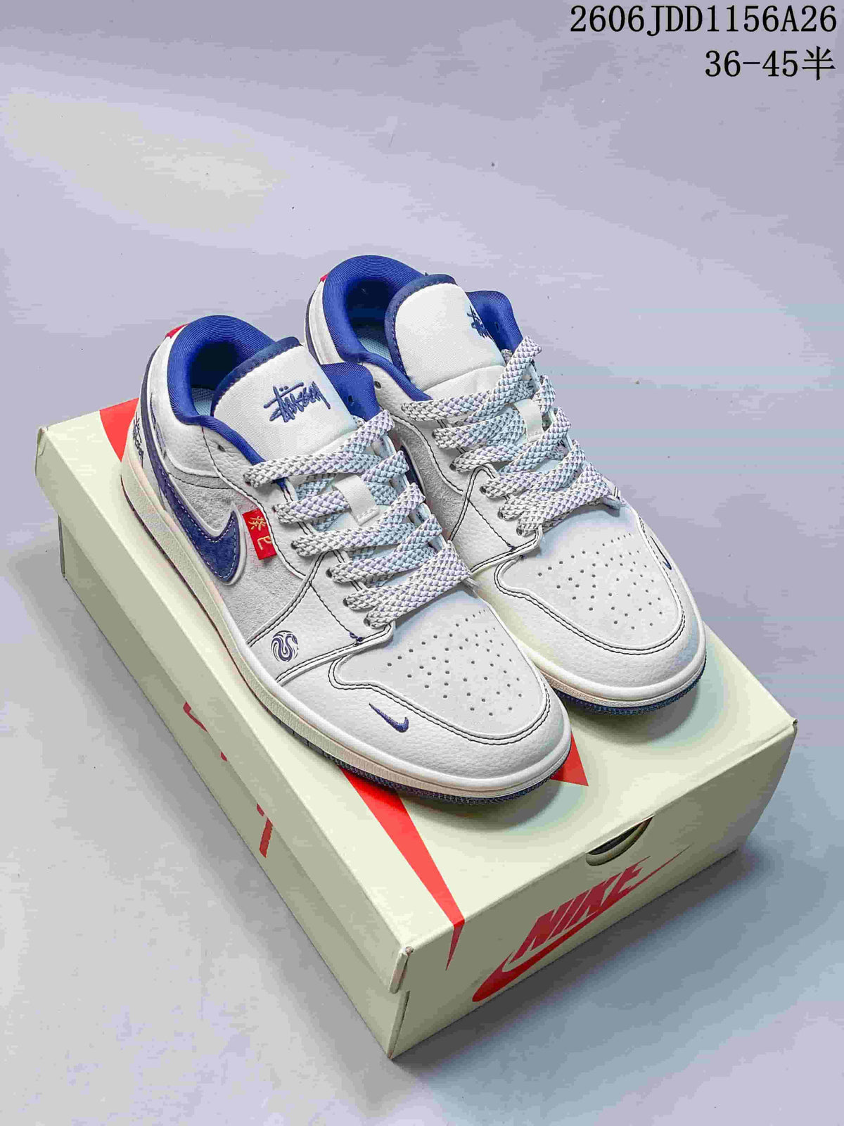 White and blue low-top sneakers with patterned side panels and contrasting laces, shown on a shoebox.