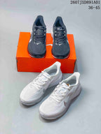 Dark gray and white Nike Air Zoom Pegasus 42 shoes shown together.