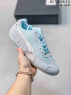 Pale blue and grey PUMA sneaker with mesh panels, white side detailing, and matching laces.
