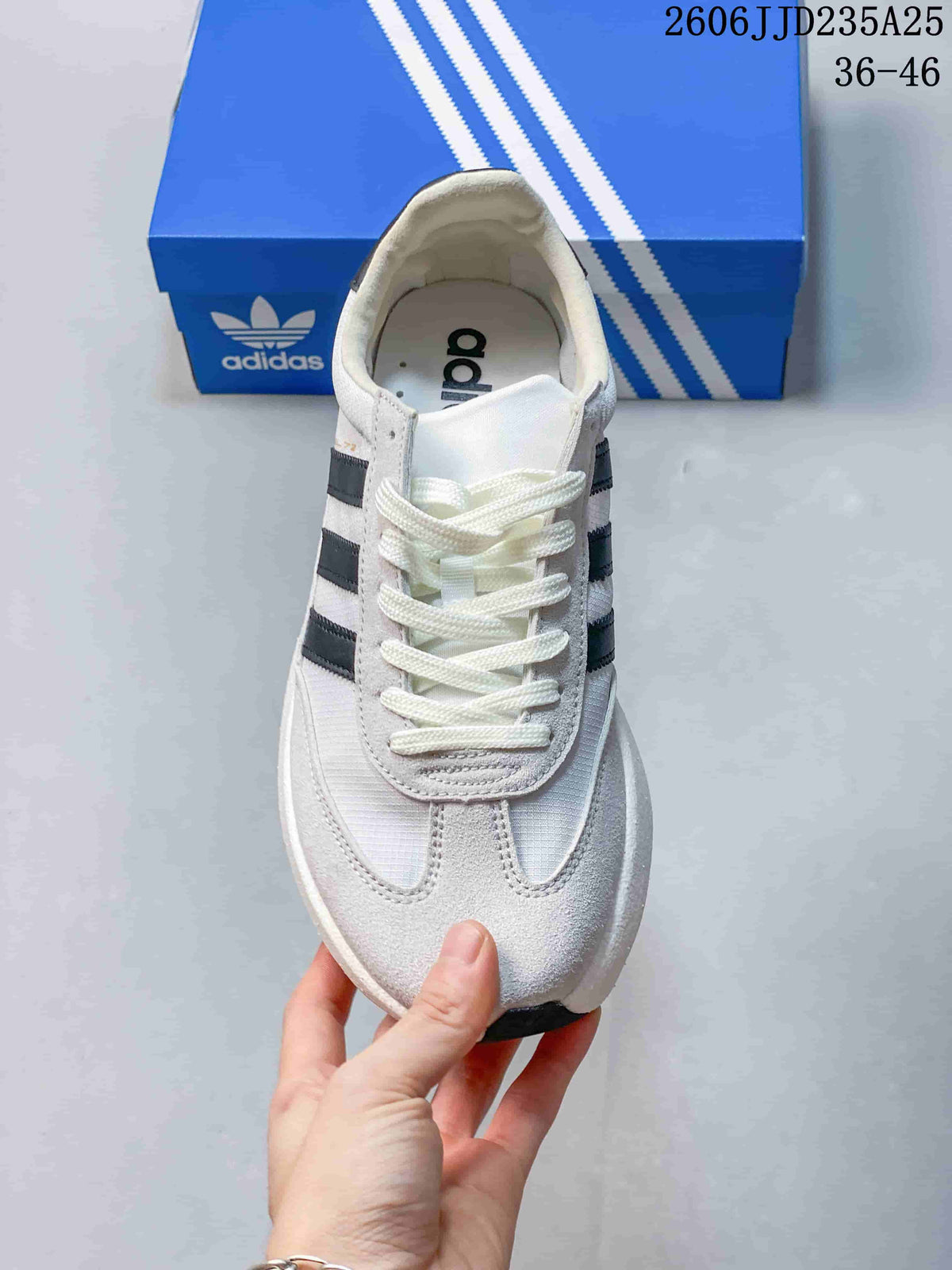 Top view showing the white laces, layered toe panel, and black side stripes.