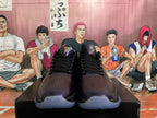 Front view of black and purple Nike basketball shoes with gold Kobe logos