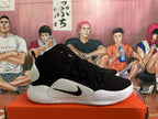 Side profile of a black and white Nike Hyperdunk basketball shoe