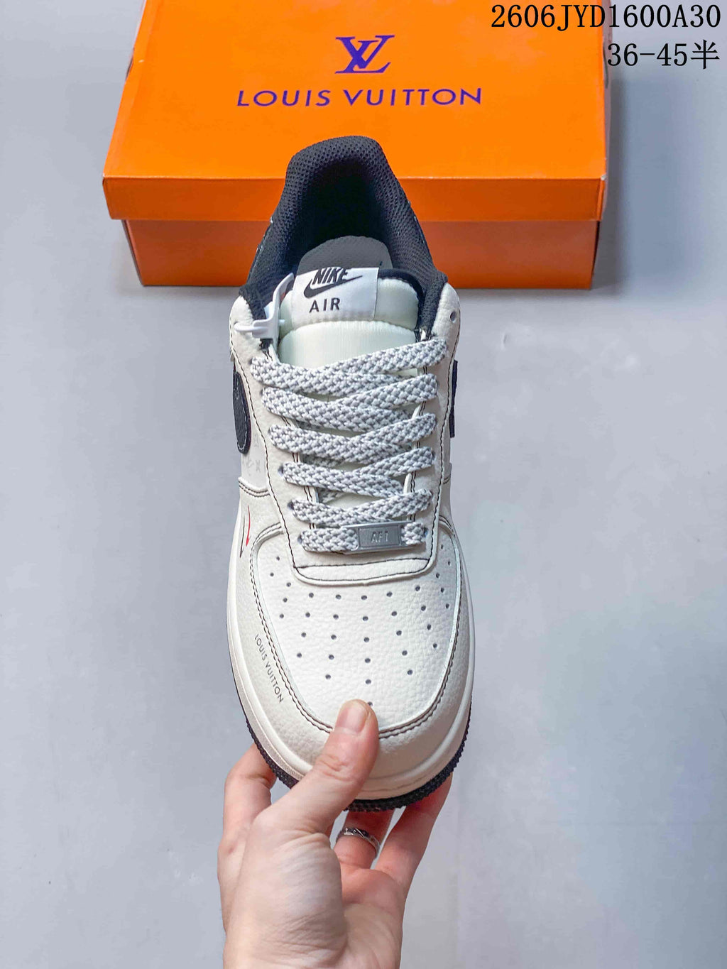 Front view showing the perforated toe, patterned laces, and dark padded collar
