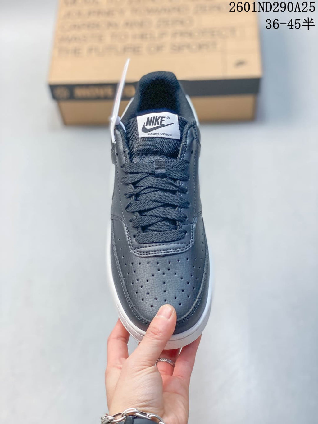 Top view of the sneaker showing the perforated toe, dark laces, and Court Vision tongue label.