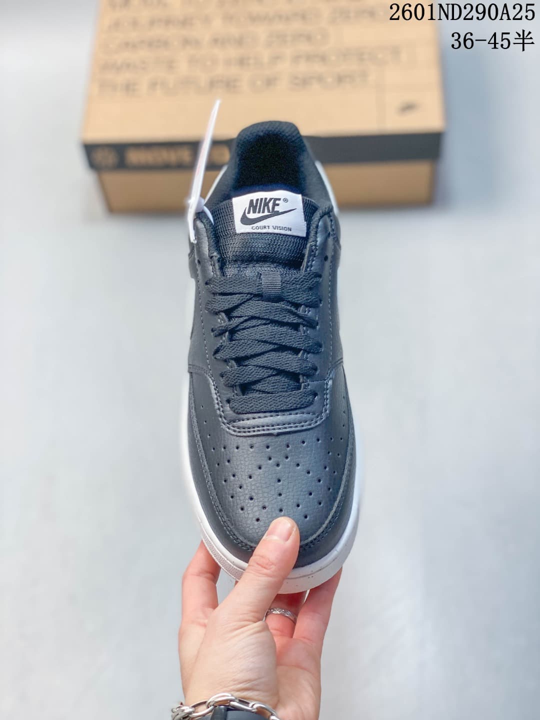 Top view of the sneaker showing the perforated toe, dark laces, and Court Vision tongue label.