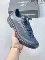 Angled side view of the gray lace-up shoe with a lugged outsole