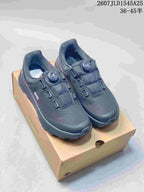 Pair of black DESCENTE SHIELD Mantrix sneakers displayed on a shoe box; mesh uppers, dial closures, and the printed size range are visible.