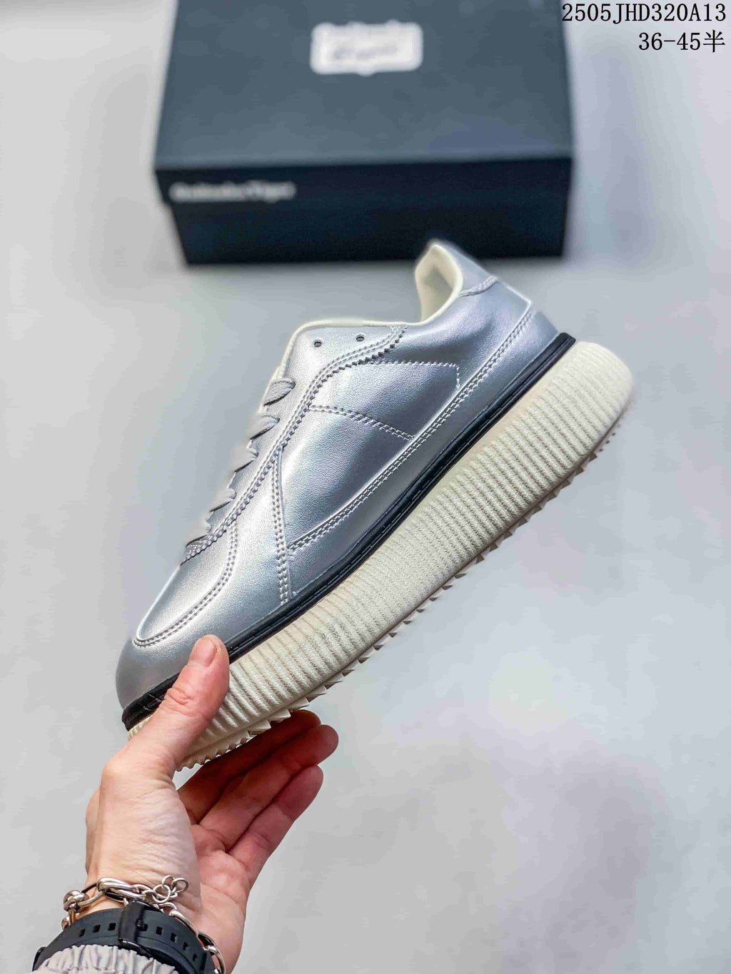 Side view of the metallic silver low-top sneaker