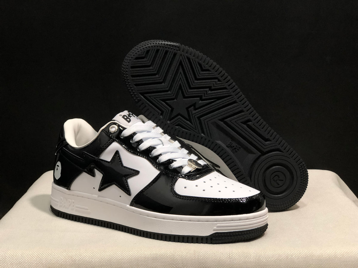 Angled view of the sneaker beside its black outsole, which features star and geometric tread patterns.