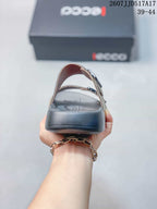 Rear view of the sandal showing the open heel, dark outsole, and two buckle straps.