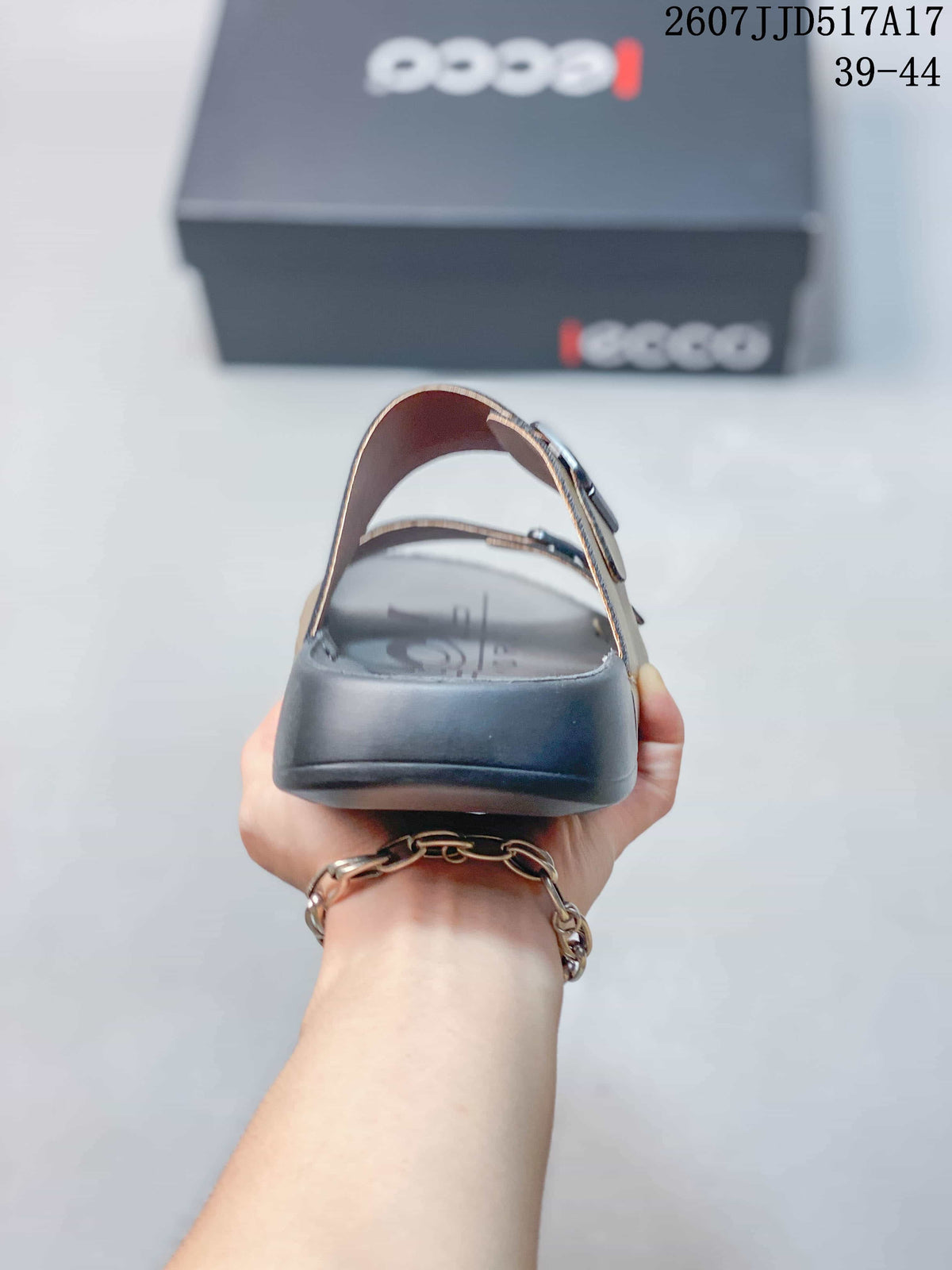 Rear view of the sandal showing the open heel, dark outsole, and two buckle straps.
