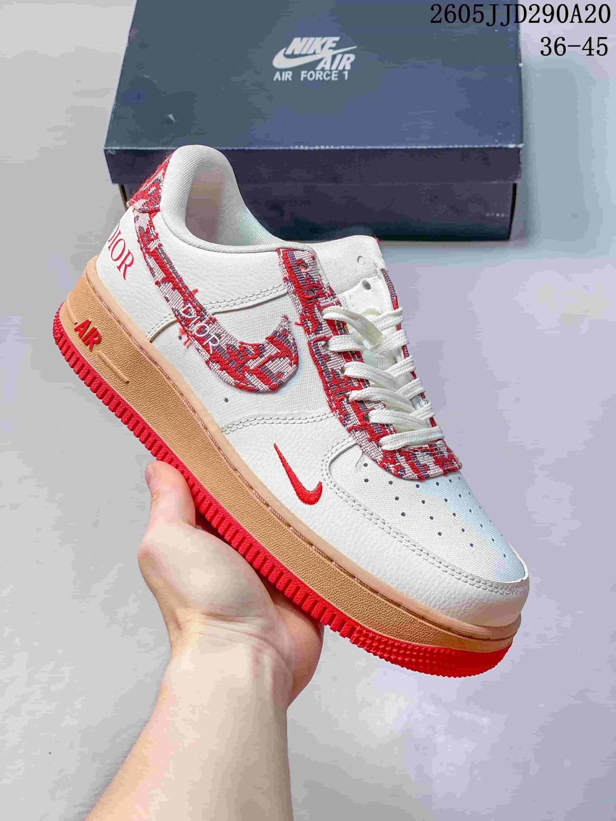 White low-top sneaker with red patterned accents and a red outsole