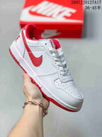 White and red Nike SB Dunk Low Pro sneaker with red Swoosh, collar accents, and outsole.