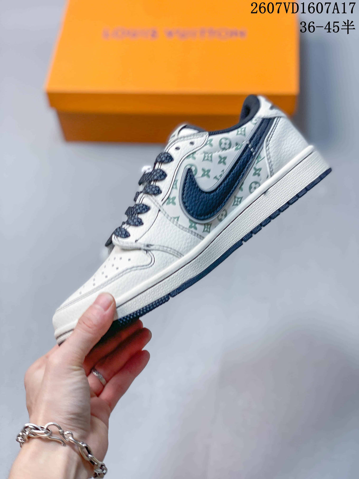 Side profile showing the white low-top silhouette, navy Swoosh-style overlay, and pale green monogram-style panel.
