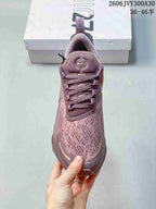 Front view showing the patterned upper and laces of the mauve sneaker