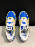 Top view of blue and yellow BAPE STA sneakers with white laces and perforated toe panels