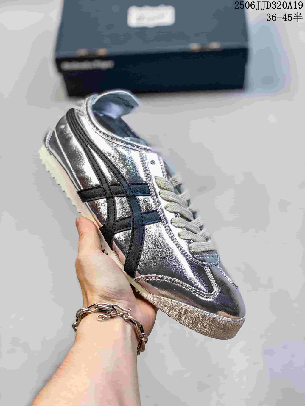 Metallic silver low-top sneaker with black side stripes