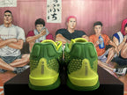 Rear view of green Nike basketball shoes with bright yellow-green heel accents.