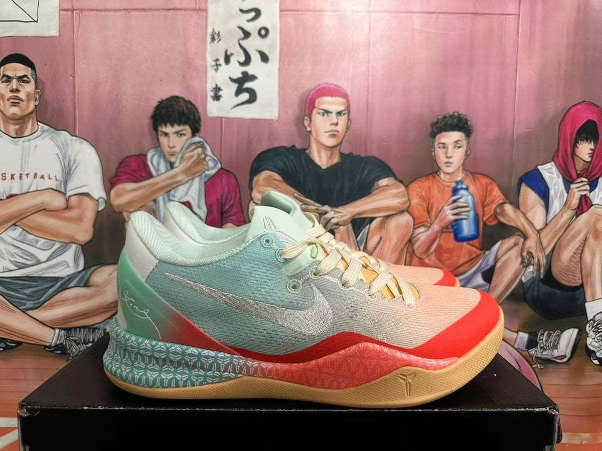 Side view of a low-top shoe showing the Swoosh, mint upper, coral midsole accents, and gum outsole.