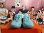 Front view of blue Nike basketball shoes with mesh uppers, laces, and Swoosh logos.