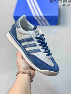 White and blue adidas SL 72 sneaker with blue stripes and a blue heel panel.