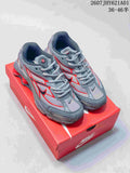 Pair of grey and red Nike Shox Ride 2 sneakers on a red shoe box