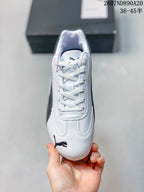 Top view showing the white laces, tongue branding, and Puma logo on the toe