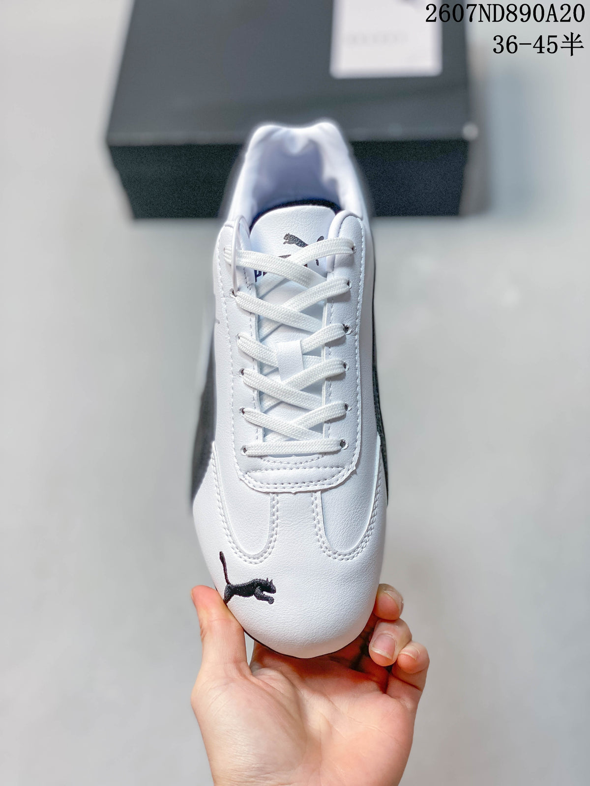 Top view showing the white laces, tongue branding, and Puma logo on the toe