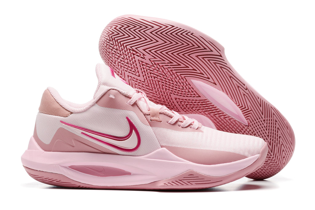 Pale pink basketball shoe with deeper pink accents and a matching outsole.