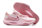 Pale pink basketball shoe with deeper pink accents and a matching outsole.