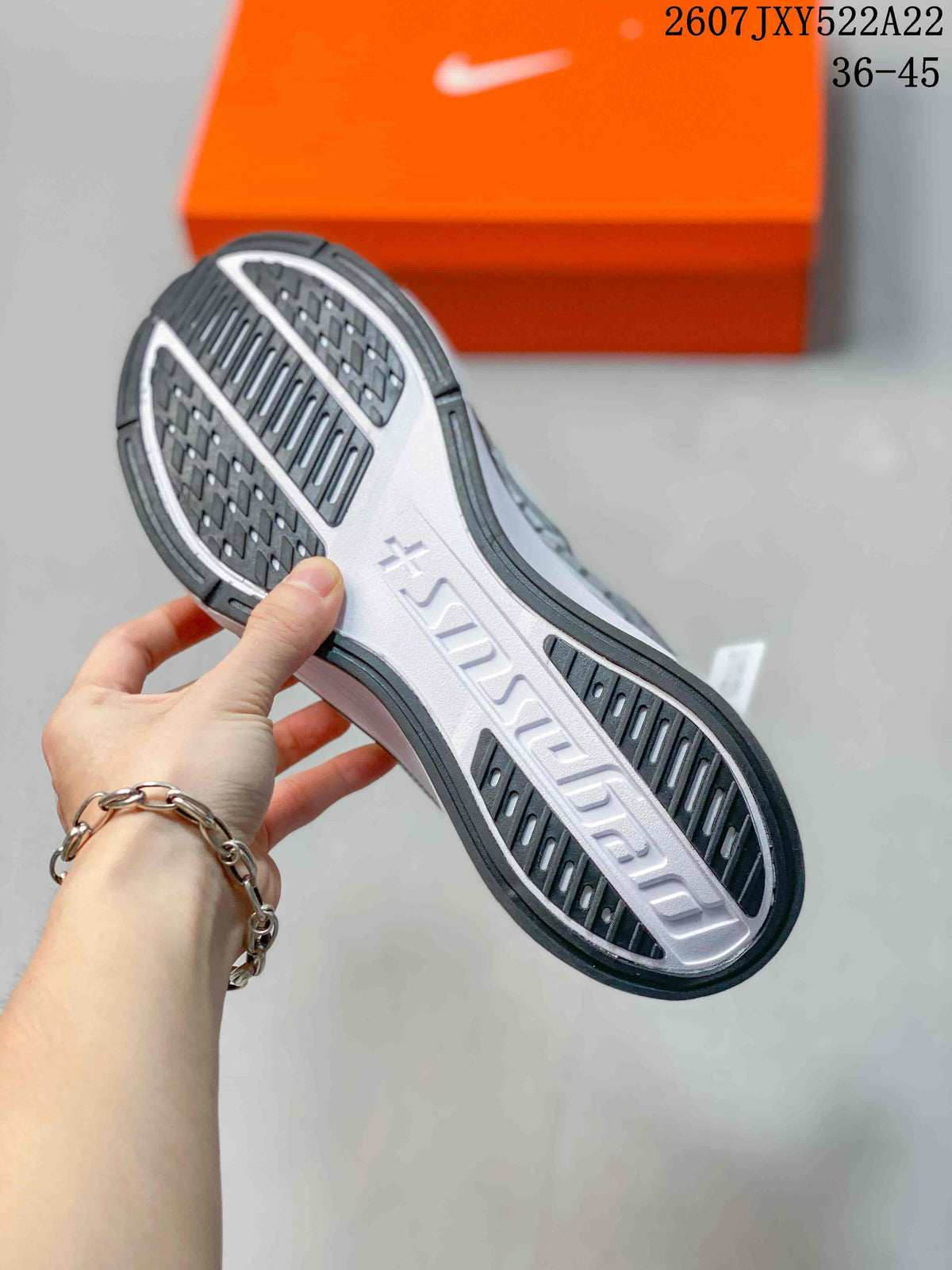 Close-up of the textured outsole showing black tread sections and raised Air Zoom lettering