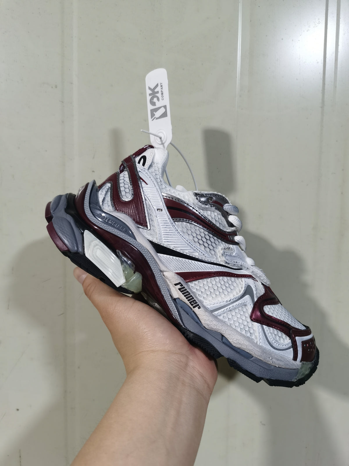 Angled view of the Puma Runner 2 sneaker showing the textured upper, contrasting overlays, and outsole details.