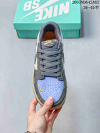 Top view of the lace-up shoe with a perforated light blue toe panel and yellow accent