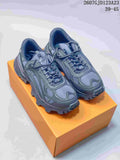 Pair of dark gray Louis Vuitton Summit chunky sneakers displayed on an orange shoe box; style code 2607GJD123A23 and size range 39-45 are visible at the top.