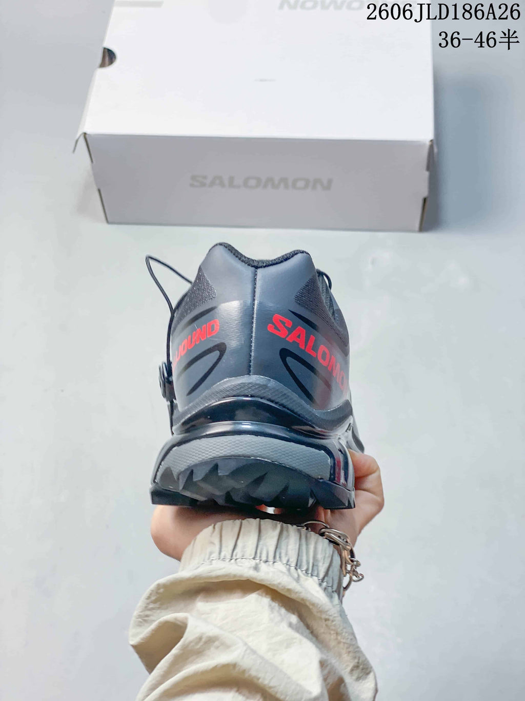 Rear view of the gray shoe showing the heel and outsole