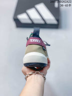 Rear view showing the Terrex heel label, pull tab and layered white and navy sole.