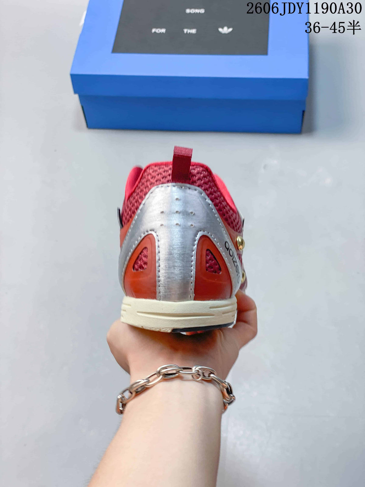 Rear view showing the silver-tone heel panel and rose mesh.
