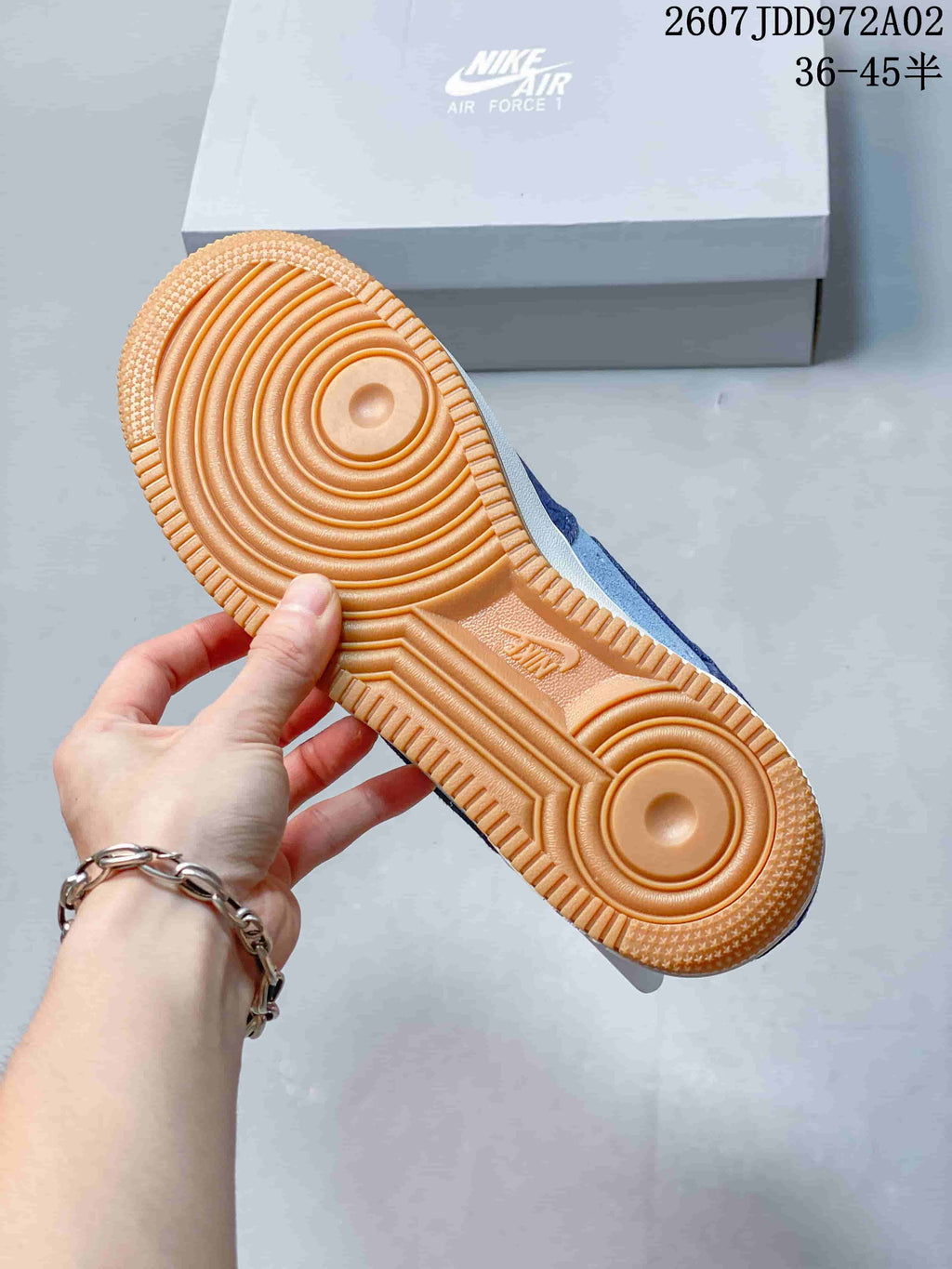 Gum-colored outsole of the blue Nike Air Force 1 sneaker