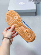 Gum-colored outsole of the blue Nike Air Force 1 sneaker
