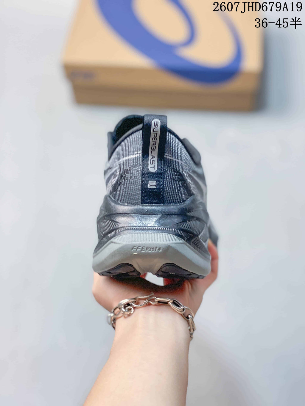 Rear view showing the heel construction, pull tab, and Superblast branding.