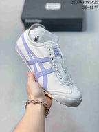 White Onitsuka Tiger slip-on sneaker with lavender side stripes and a light-colored outsole.