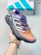 Side view of a purple, orange, and gray adidas Equipment Adios Pro sneaker with purple laces and a dark sole.