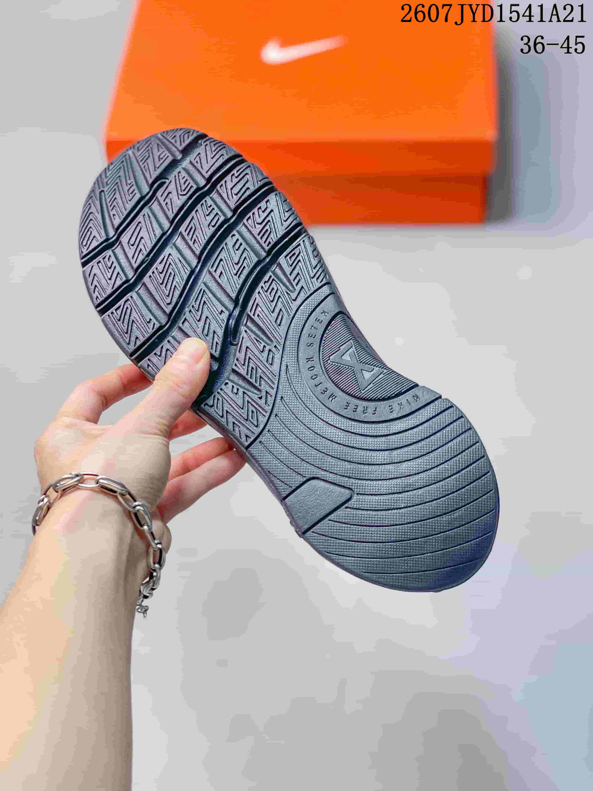 Close view of the black sneaker outsole showing its patterned tread.