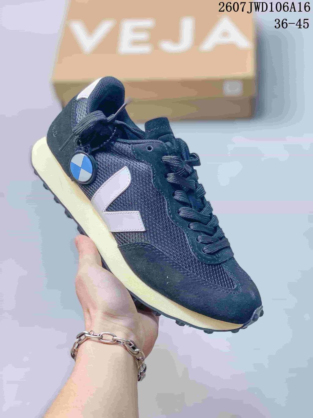 Dark navy VEJA Rio Branco sneaker with a light V logo and cream-colored midsole.