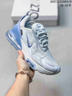 White Nike Air Max 270 Premium sneaker with blue accents and a translucent blue heel air unit.
