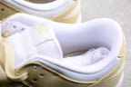 Close-up of the padded white collar, tongue, laces, and pale cream upper panels.
