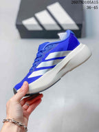 Side profile of the blue and white low-top sneaker showing the layered side stripes and sculpted midsole.